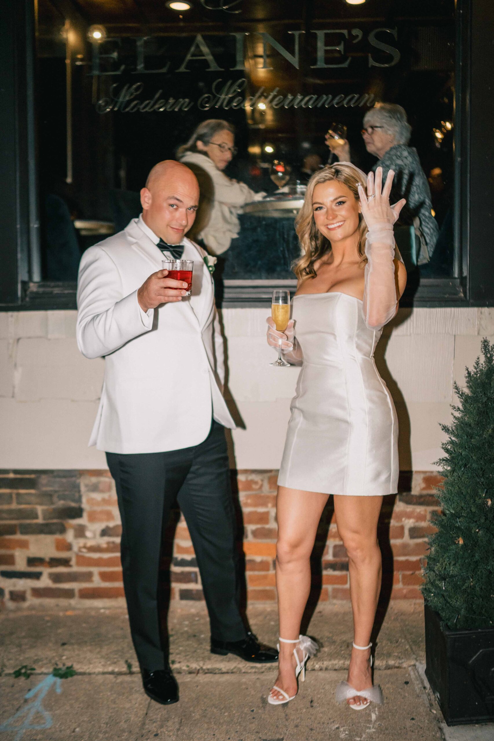 married couple picture in front of elaines_restaurant at old town Alexandria in Northern Virginia