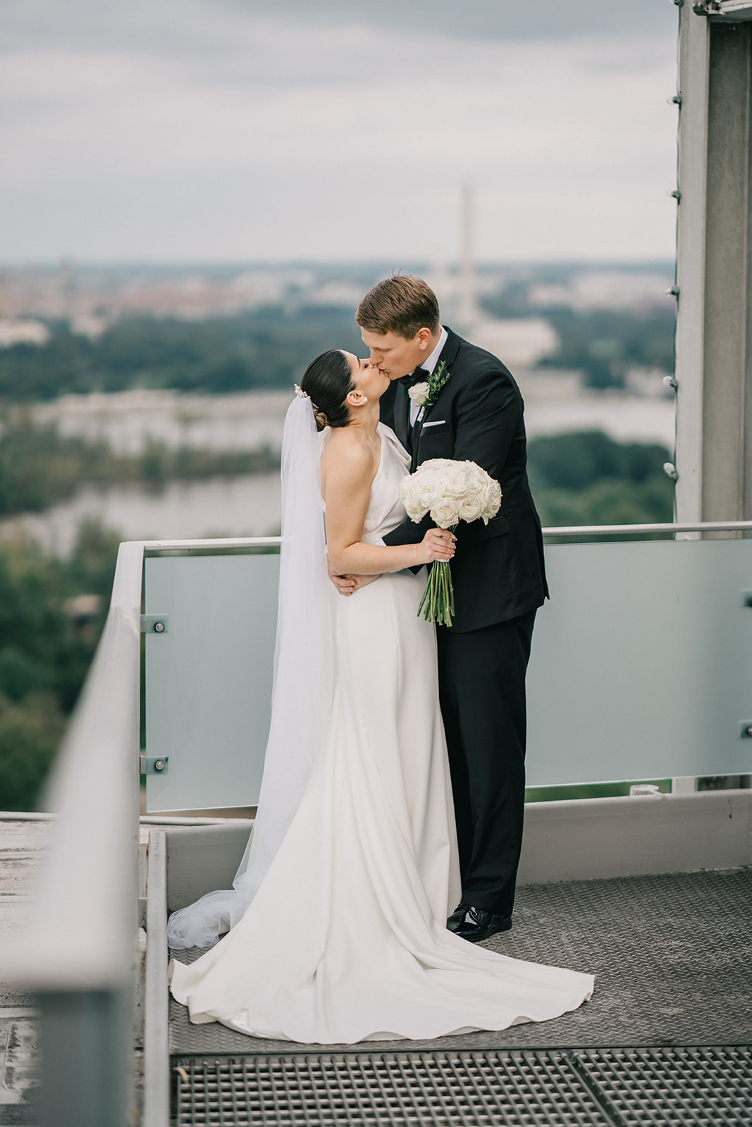 top of the town wedding photo couple portrait standing on rooftop