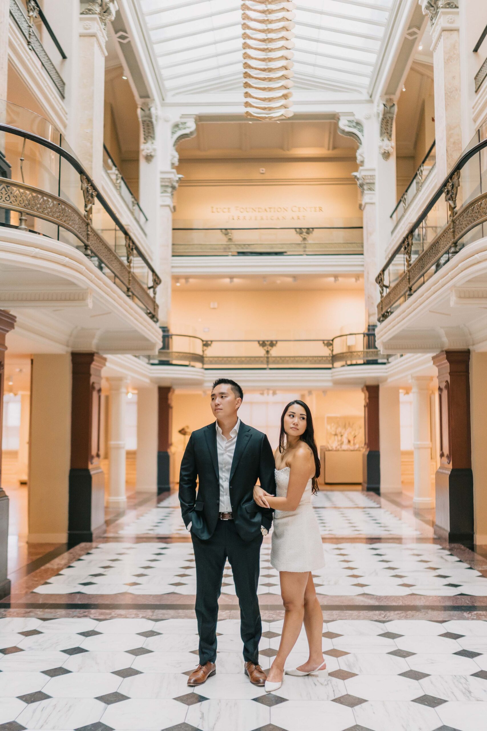 National Portrait Gallery engagement session couple holding arms looking at different direction