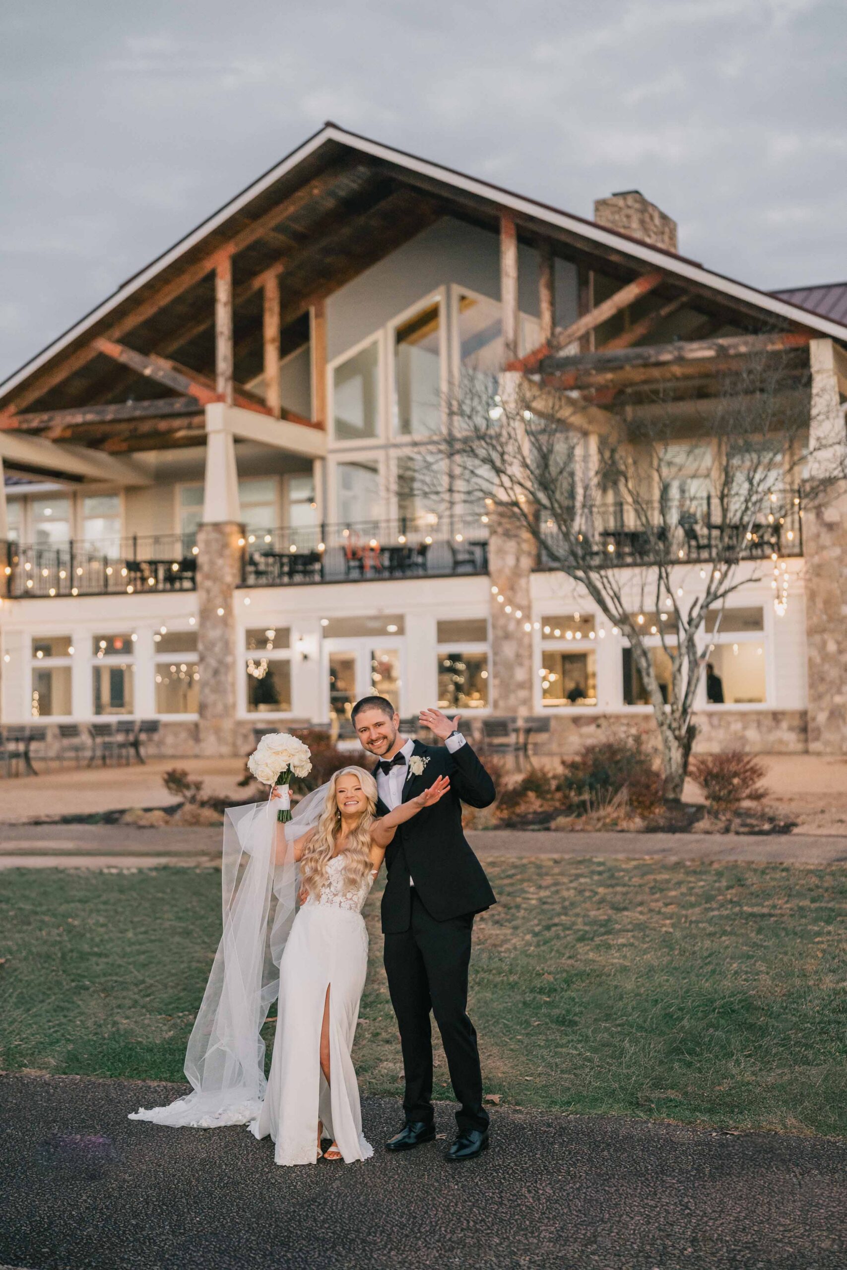 Bull Run Golf Club wedding couple showing their rings in front of the club building